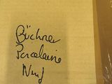 a piece of paper with writing on it sitting in a box