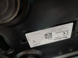 a close up of a car ' s rear bumper with a qr code on it