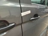 a close up of a car door handle with a sticker on it