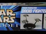 a box of star wars toys on display on a table