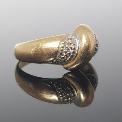 an image of a gold ring with diamonds on it