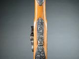 an image of a wooden stick with a carving of a man and a woman on it