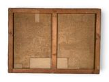 an old wooden frame with a cork board attached to it