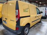 a yellow van that is parked in a garage