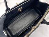 the inside of a black handbag with a zipper on it