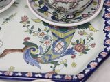 a tray with two cups and a saucer on it