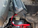a car battery in the trunk of a vehicle