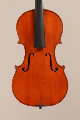 an old violin with a bow hanging from it ' s back