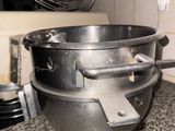 an image of a large metal bowl on a kitchen counter