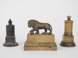 two bronze figurines of a lion and a lion on a pedestal
