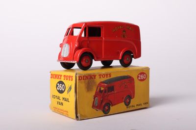 a red toy truck sitting on top of a box