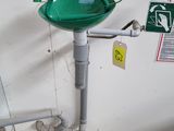 a green sink sitting on the side of a wall