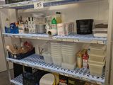 a metal shelving with many items on it