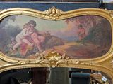 a picture of a mirror with a painting on it