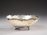 silver plated bowl on stand on grey background with gray background