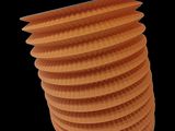 a stack of orange paper lanterns on a black background