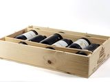 bottles of wine in a wooden box on a white background