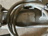 a close up of a hose connected to a water meter