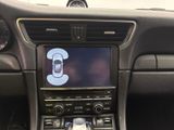 a picture of a car dashboard with a cell phone in the center