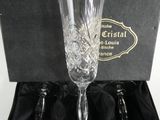 three wine glasses in a box on a table