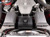 a close up of a car ' s engine with its hood open