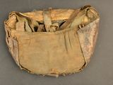 an old bag with some stuff in it on a table
