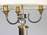 a lamp that is sitting on a table with a glass ball on it