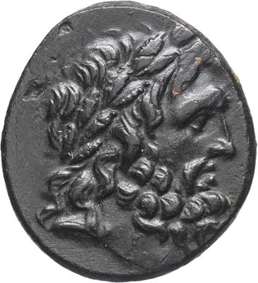 a close up of a black coin with a dragon on it