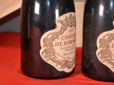 two bottles of wine that are sitting on a table