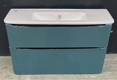 un évier blanc posé sur un meuble bleu