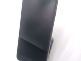 a cell phone that is sitting on top of a stand