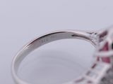 an image of a diamond and ruby ring