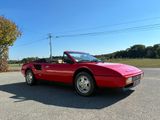 a red sports car parked in a parking lot