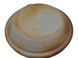 a brown and white plate on a white background