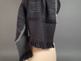 black and grey scarf on mannequin head on mannequin head