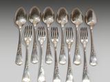six silver spoons and six forks are lined up in a row