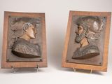 pair of bronze busts of a man and a woman
