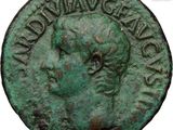 a close up of a coin with a woman ' s face on it