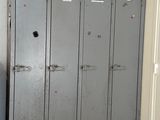 an image of a room with lockers and a clock on the wall
