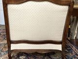a wooden frame chair with white upholstered upholstered upholstered upholstered upholstered