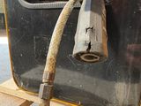 a hose attached to the side of a machine