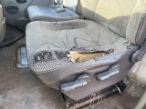 a dirty seat in the back of a car