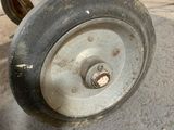 a close up of a wheel on a small plane