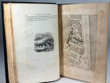 an open book with a picture of a train on it