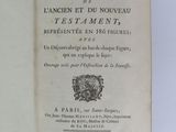 an open book with a picture of a coat of arms on it