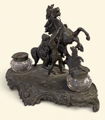 a bronze statue of a man on a horse