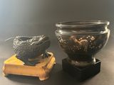 pair of asian vases with dragon heads on wooden bases