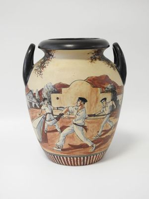 un vase sur lequel est représenté un match de baseball