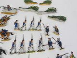 a lot of figurines that are on a table