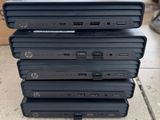 four laptops stacked on top of each other on the ground